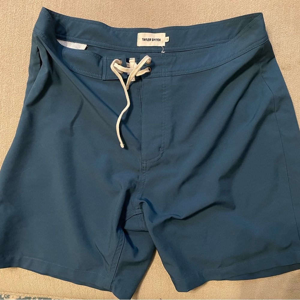 Lightly worn Taylor Stitch hybrid board shorts. Teal blue with lace closure.